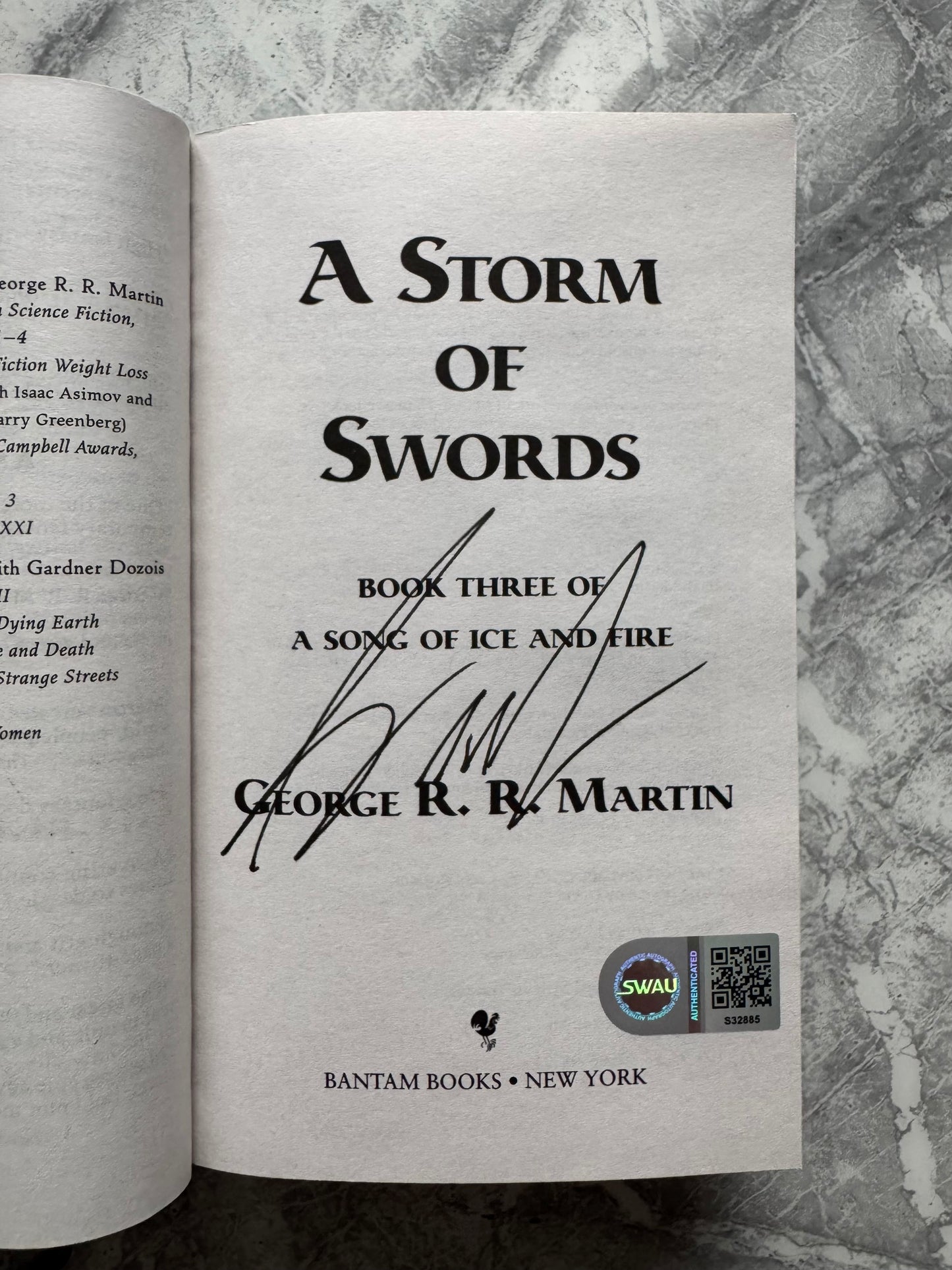 George R.R Martin Signed A Storm Of Swords Paperback Book - SWAU Authenticated